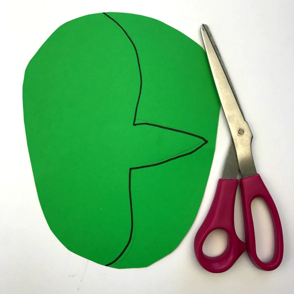 Face profile is drawn on one cut piece of construction paper - it has a round forehead and pointed nose