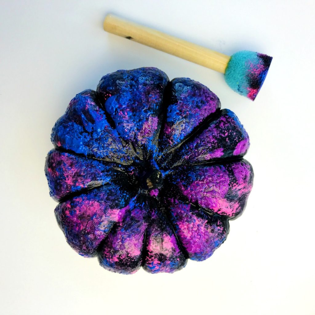 Galaxy painted pumpkin with multiple colors