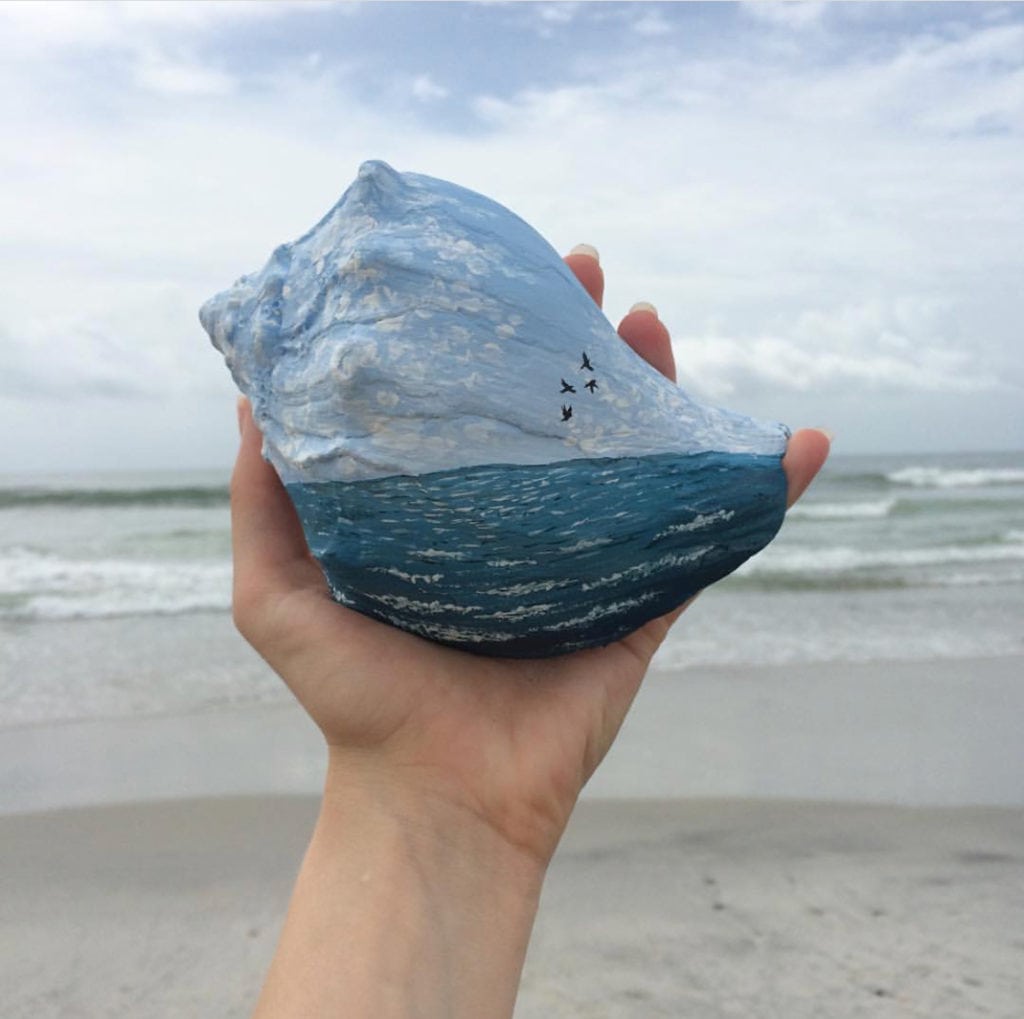 Ocean scene painted on a conch shell