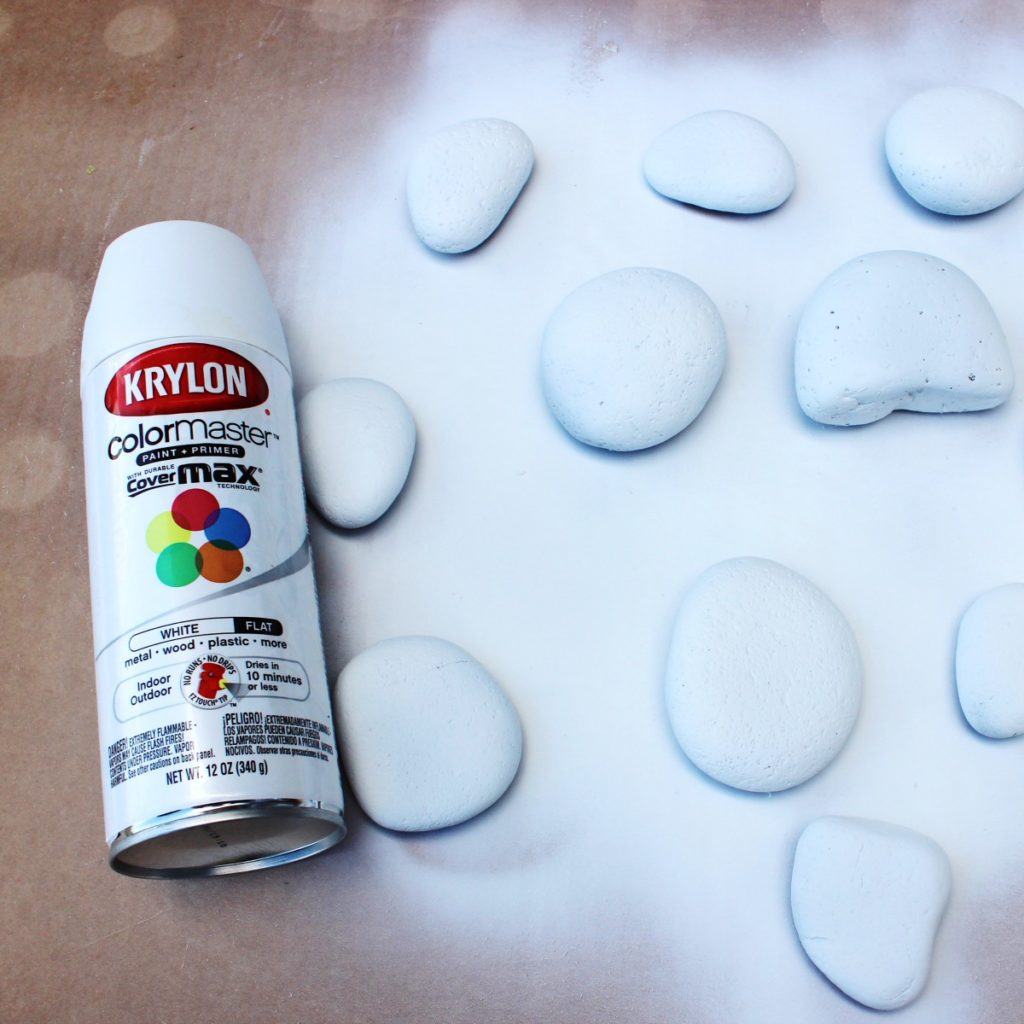 Rocks spray painted white with primer