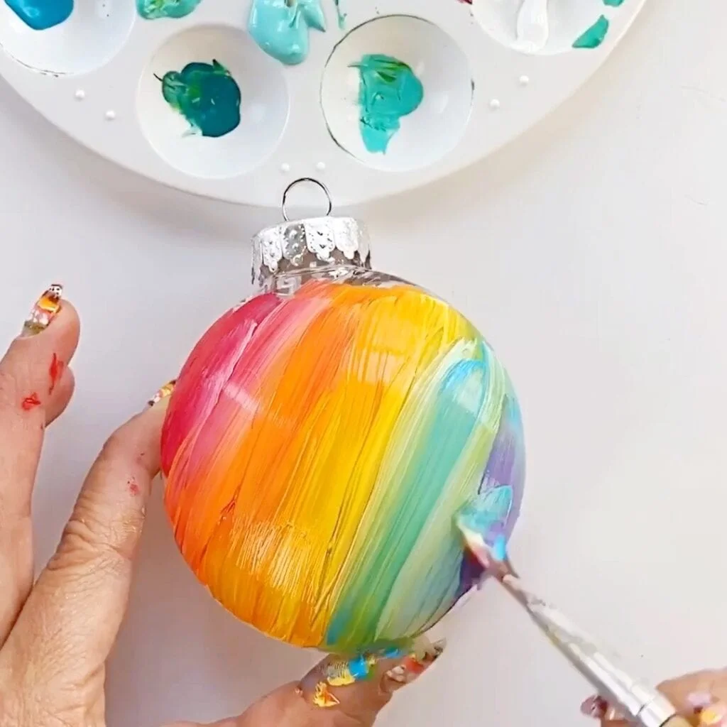 Ornament with the rainbow paint pattern all spread out - it's ready for Jack Skellington's face now