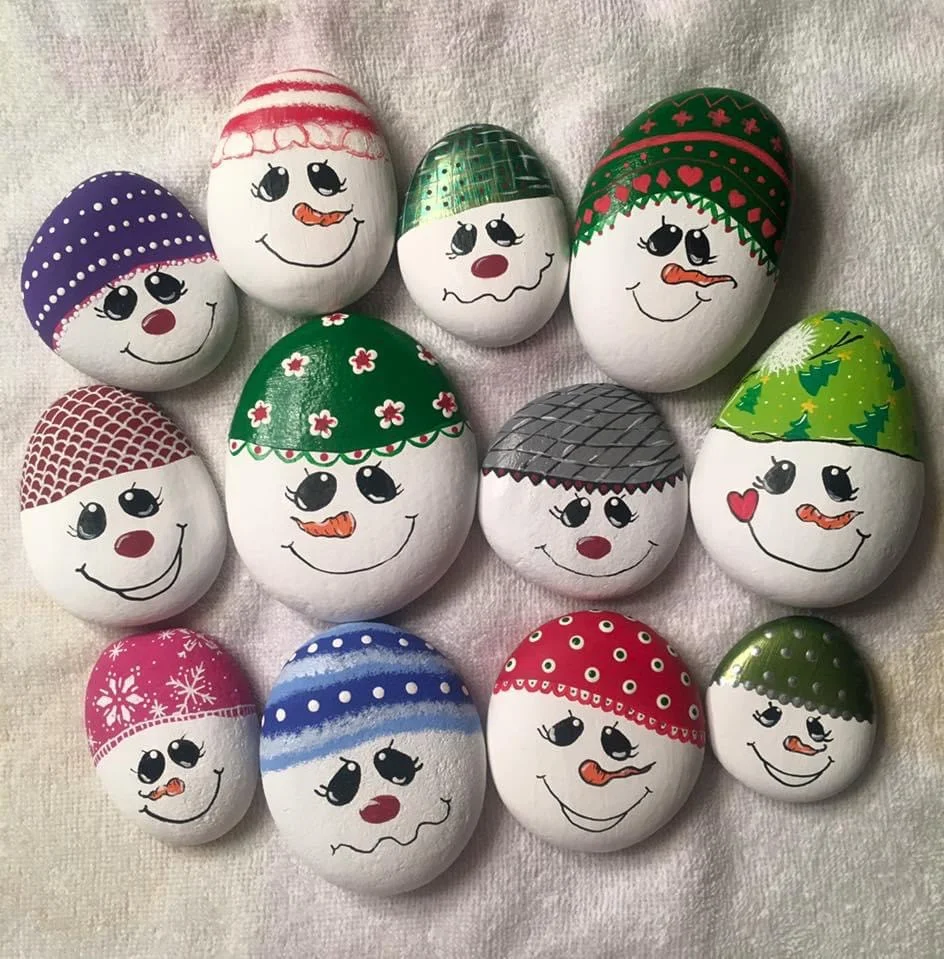 Assorted snowman face Christmas Rock Painting Ideas