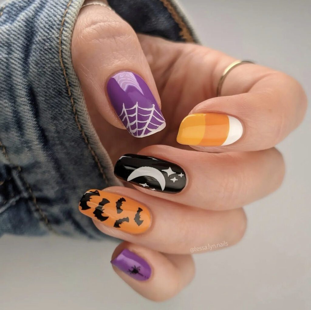Simple and Fun Halloween Nail Art with bats, spider webs, and candy corn