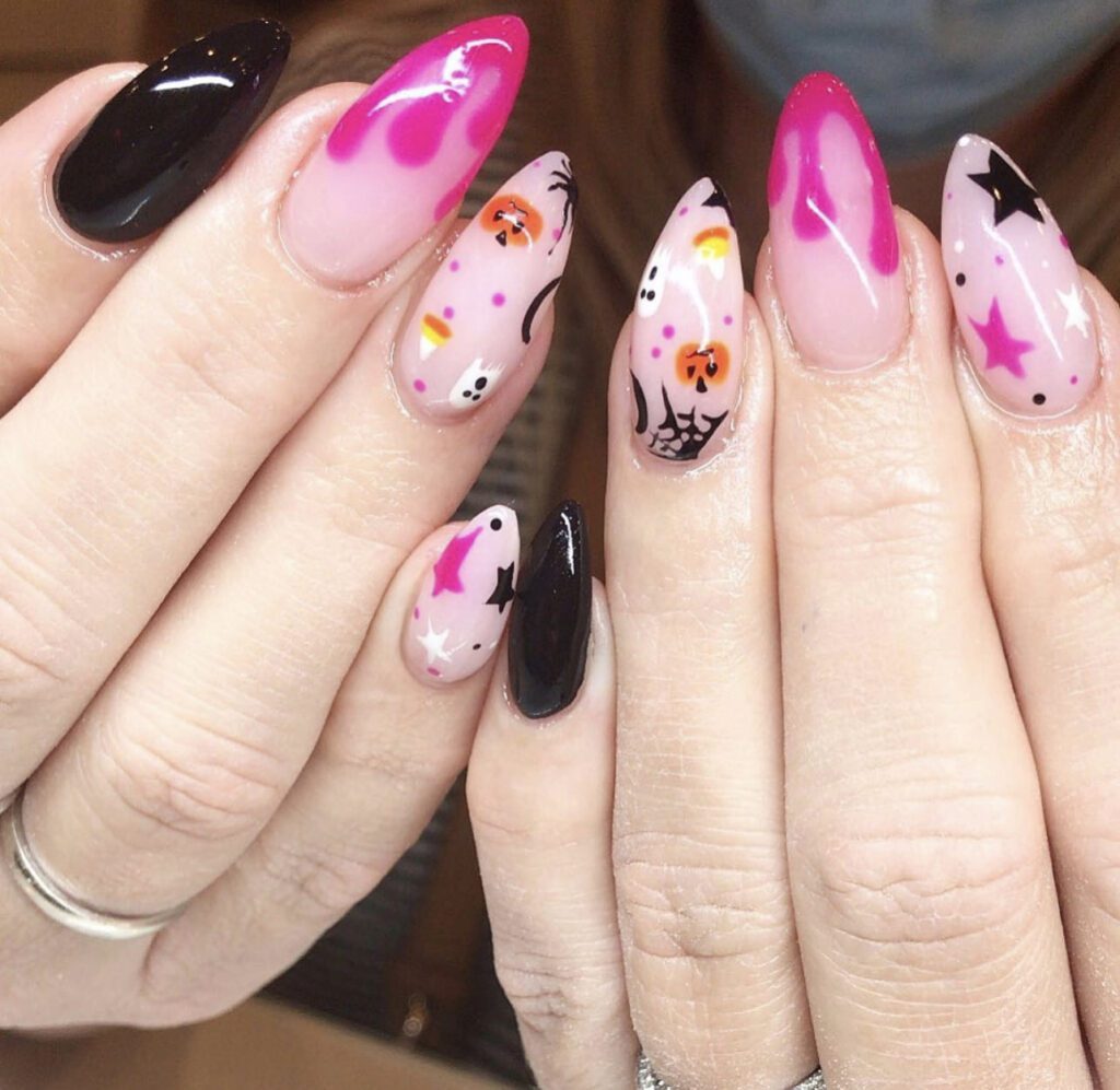 sweet and spooky pink and black halloween manicure