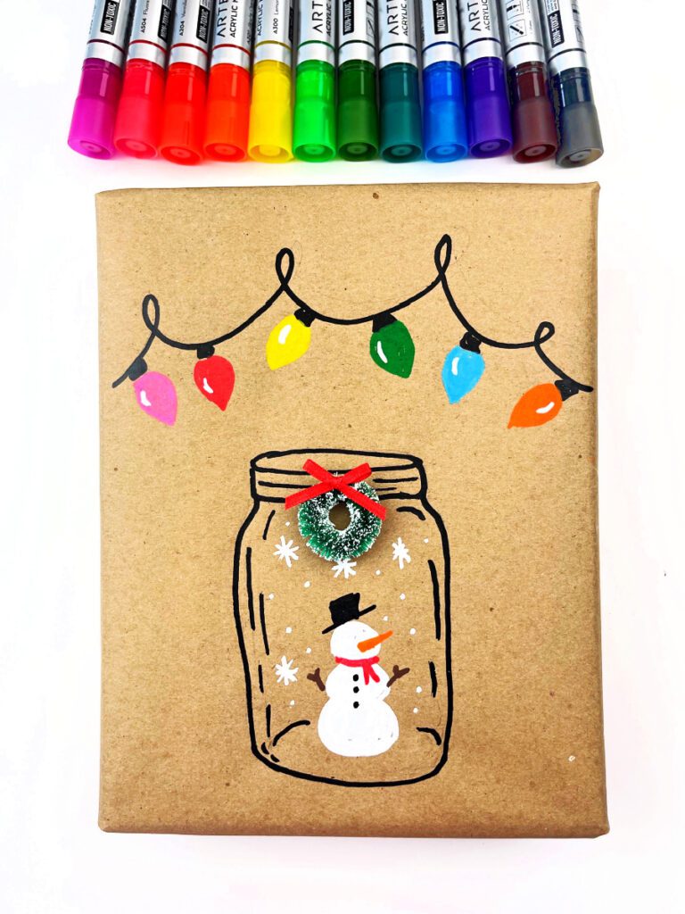 DIY Festive Christmas Wrapping Paper completed with snowman in a jar