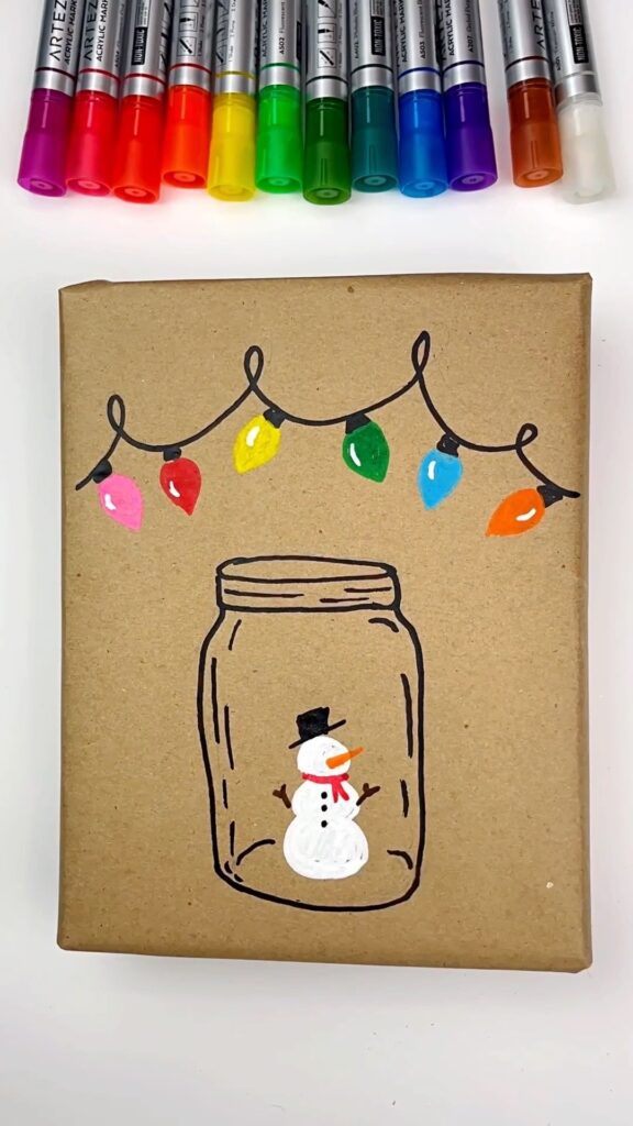 DIY Festive Christmas Wrapping Paper with a snowman inside the jar