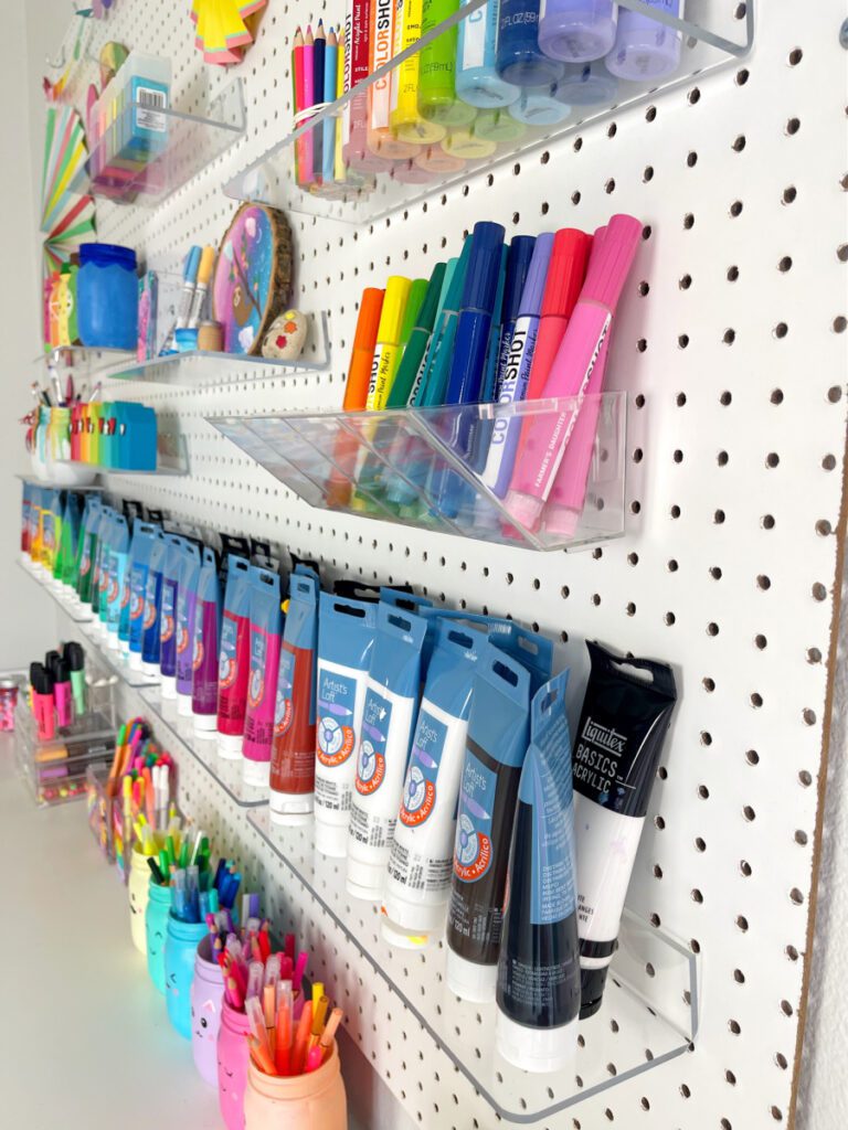 Using acrylic shelving on a pegboard for organization