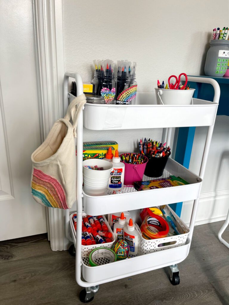 White raft room organization cart filled with supplies