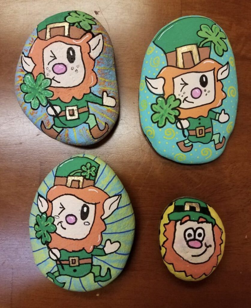St. Patrick's Day Painted Rocks with cartoon leprechauns