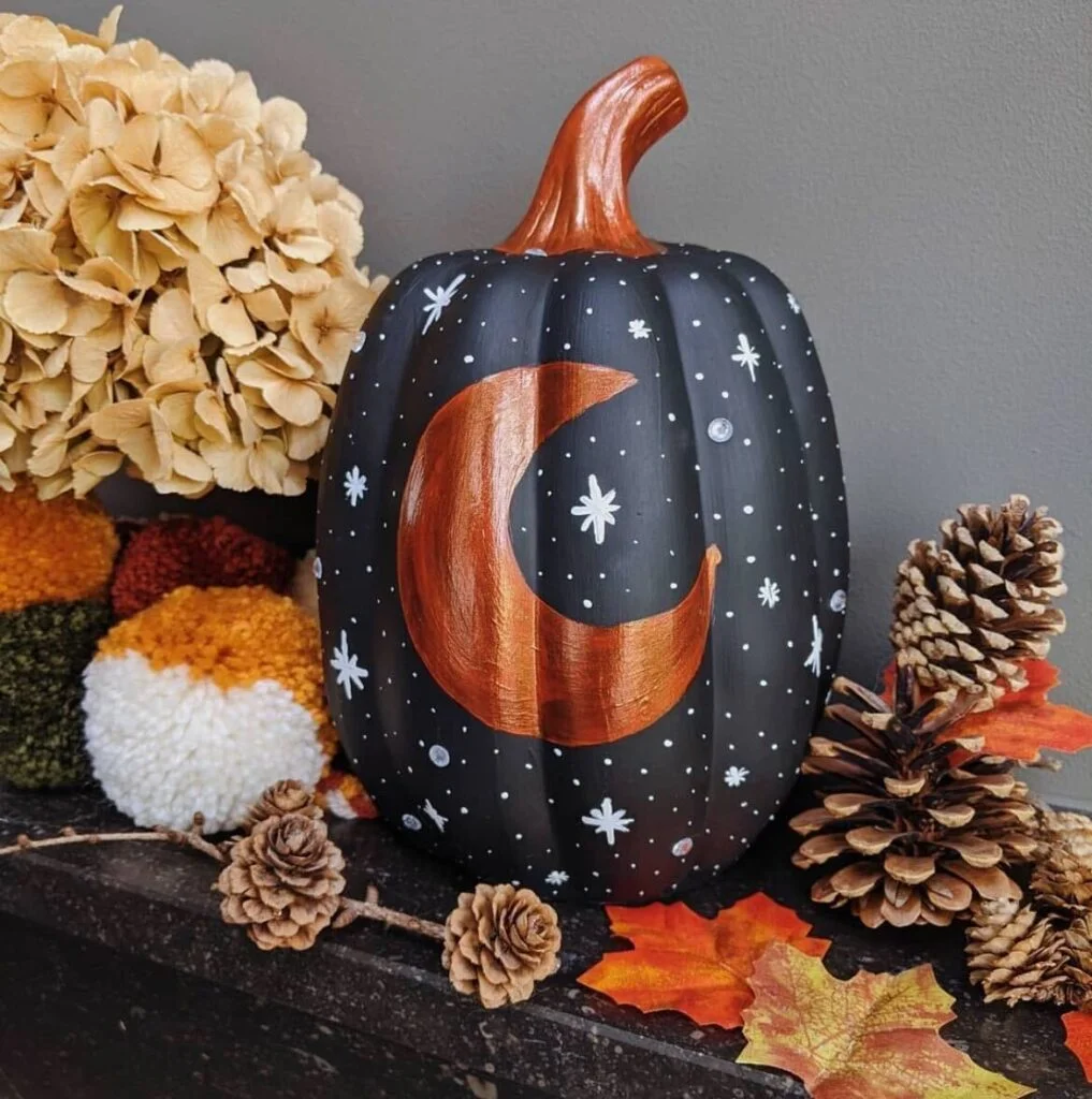 Moon and sky painted pumpkin