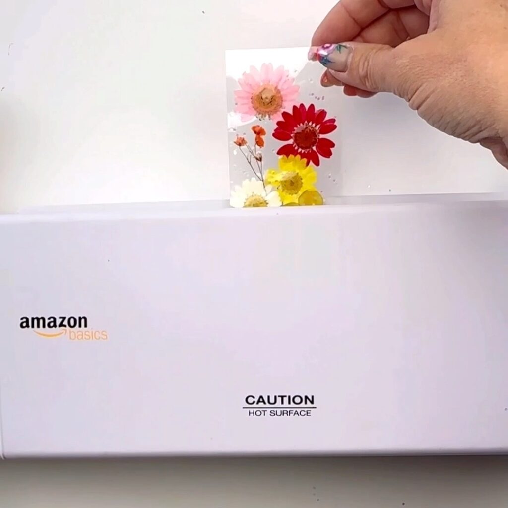 bookmark with flowers being laminated