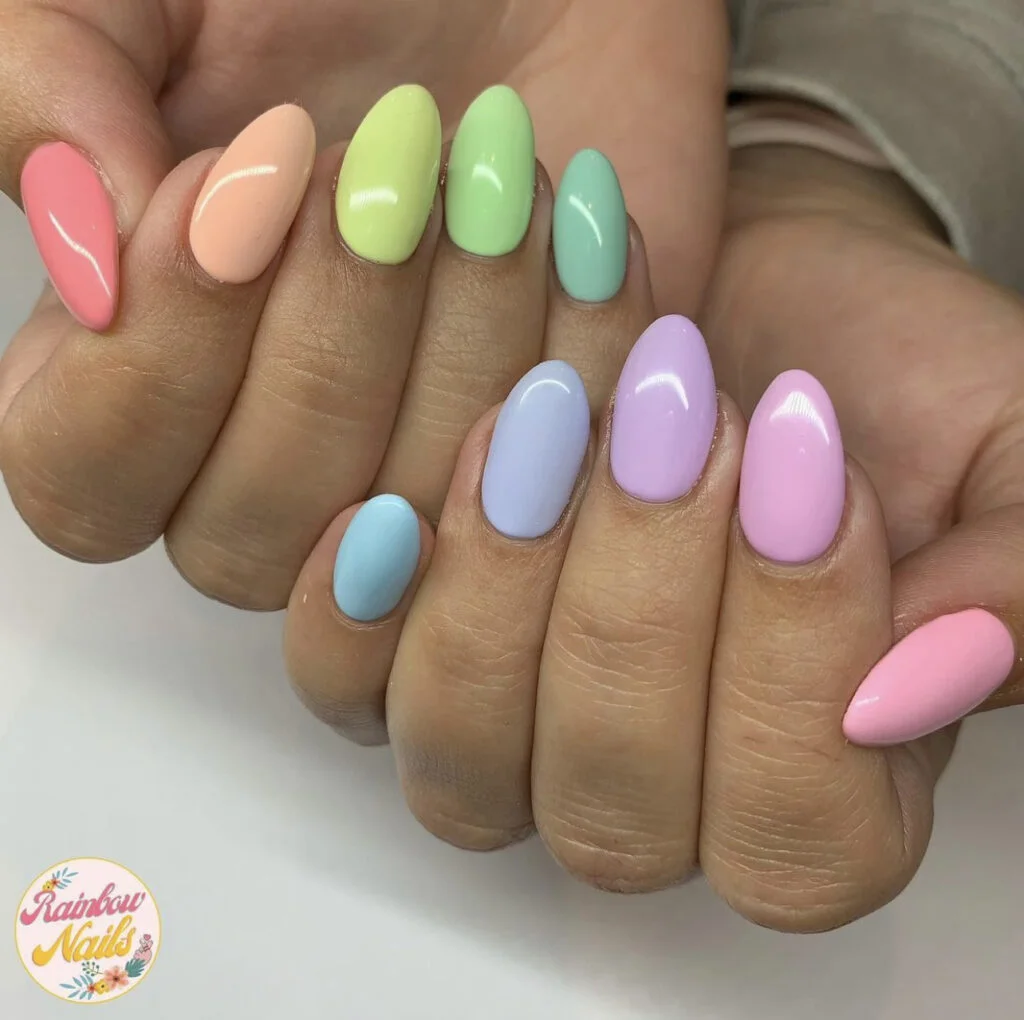 Nails painted in a rainbow of different colors