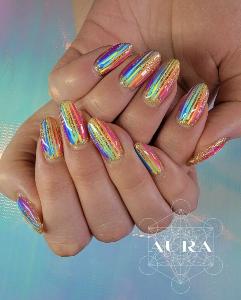 Glittery striped rainbow color manicure