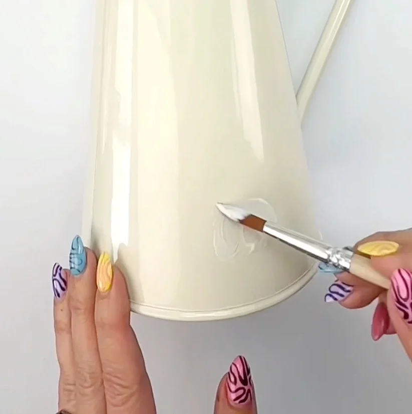 Applying mod Podge to vase