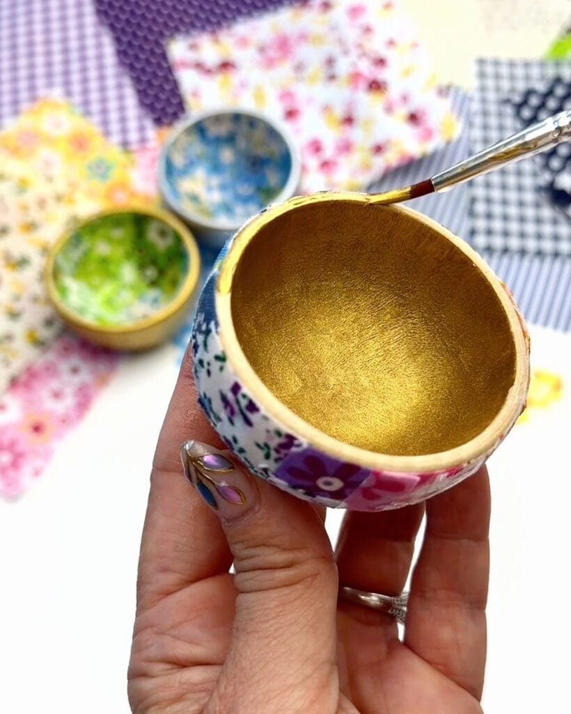 painting fabric bowl with acrylic paint on the inside