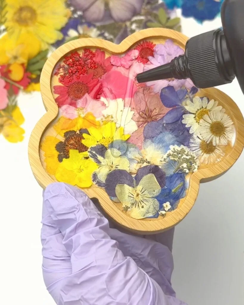 adding UV resin to wooden coasters